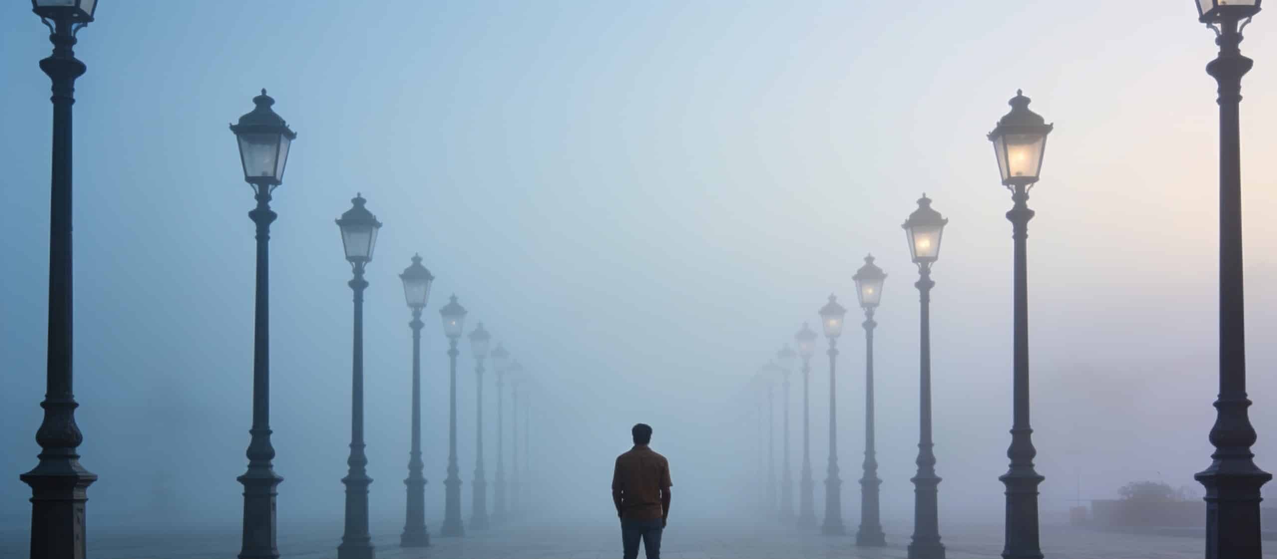 ai psychosis — Pre-dawn urban exterior: a long, empty pedestrian plaza in low fog, a receding row of identical lampposts f...