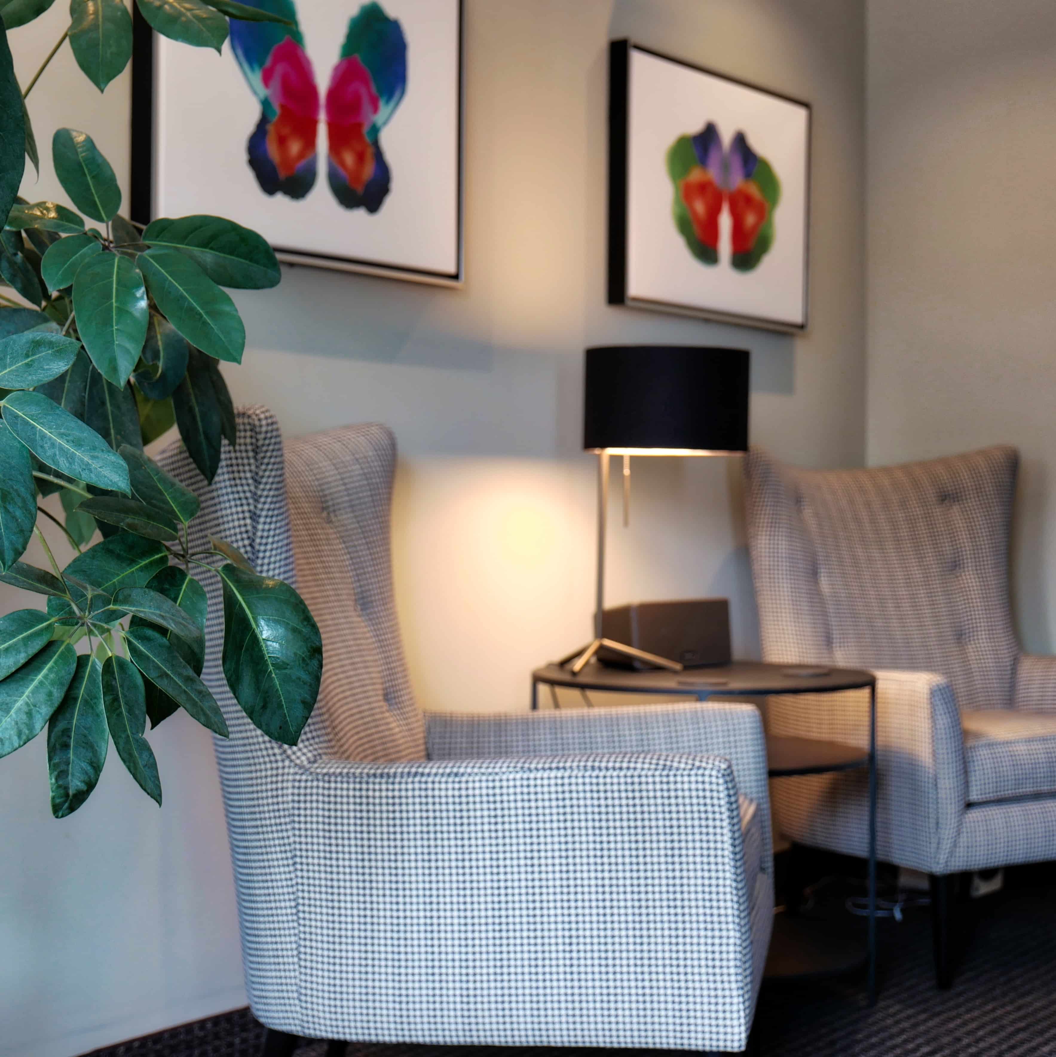 Therapy Group of DC waiting room with comfortable seating and Rorschach-inspired art